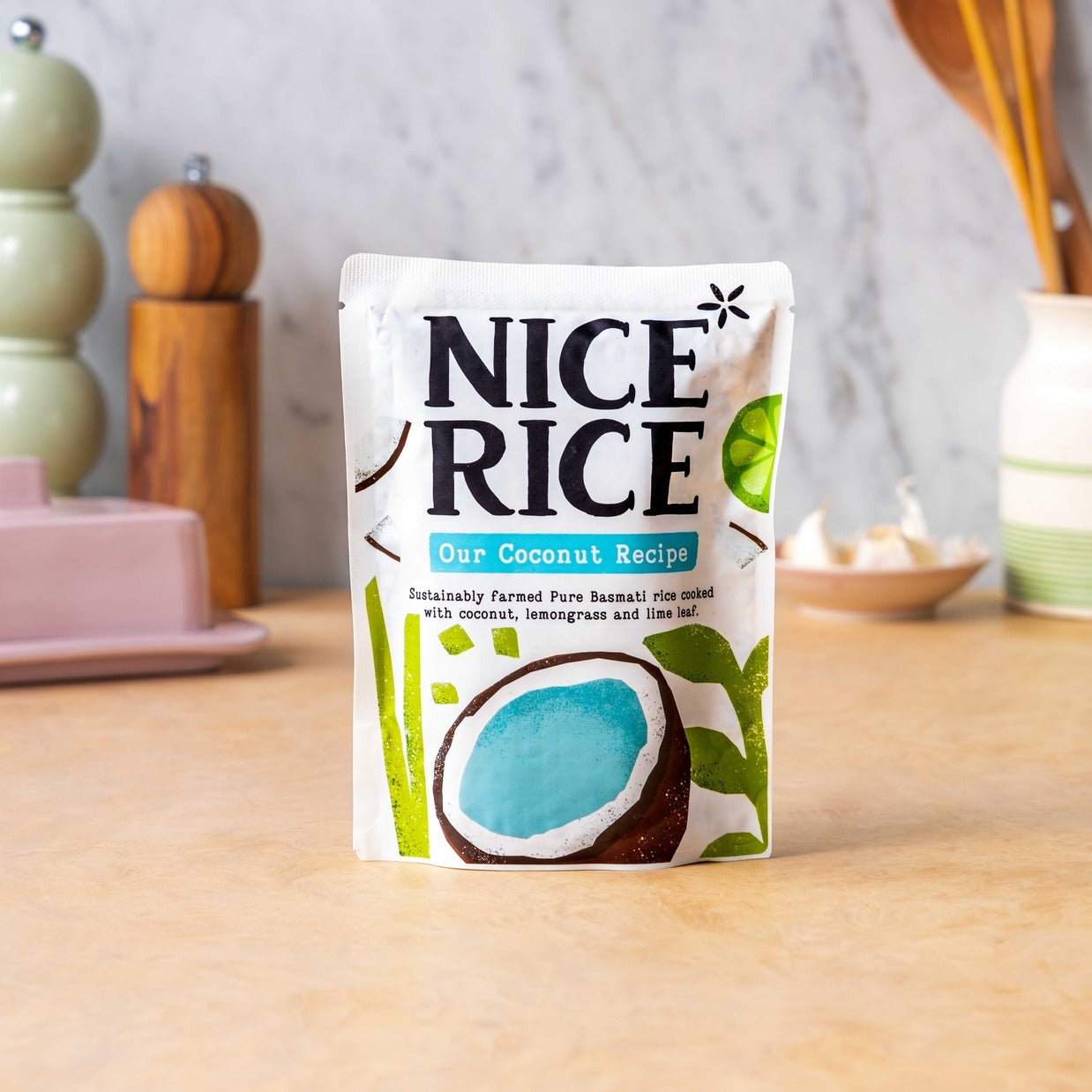 Package of Nice Rice with coconut illustration on a wooden surface