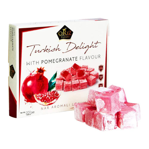 Box of Turkish Delight with pomegranate flavor and some pieces in front on a white background