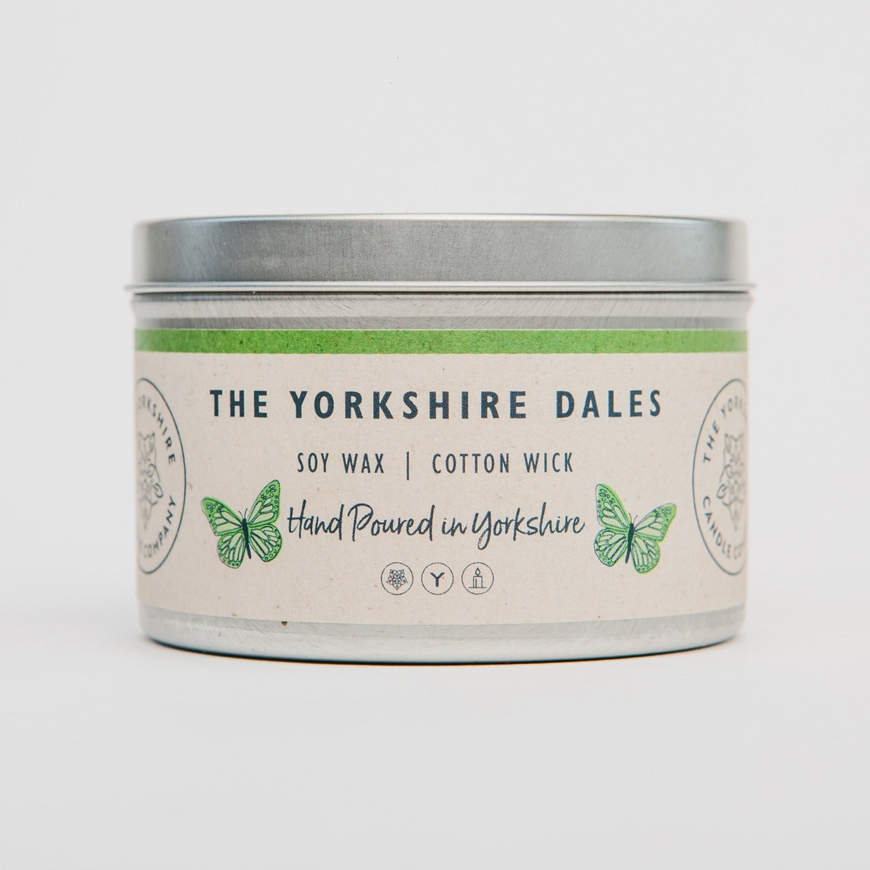Candle tin labeled 'The Yorkshire Dales' with a butterfly design on a white background