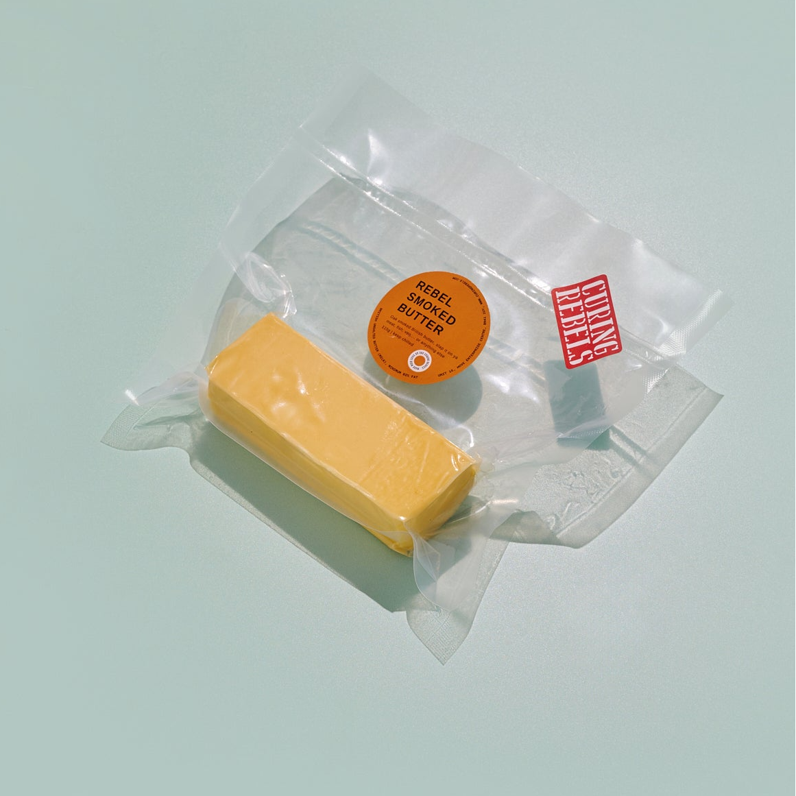 Curing Rebels smoked butter on a pastel background