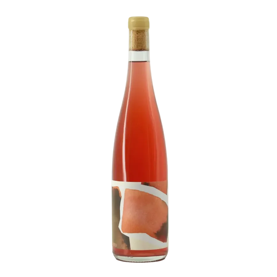 A tall glass bottle filled with pink liquid, sealed with a cork stopper, and featuring an abstract label with peach, white, and brown shapes, shown on a light gray background.