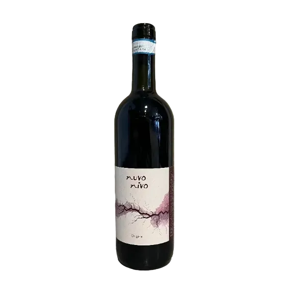 Wine bottle labeled 'nuvo nuvo' against a textured concrete wall.