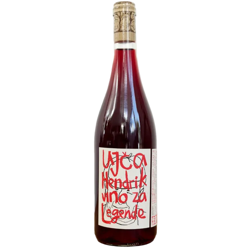 Bottle of red wine with a label on a wooden surface