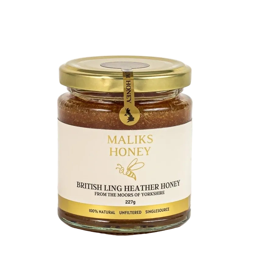 Close-up of Maliks British Ling Heather Honey on a white background 