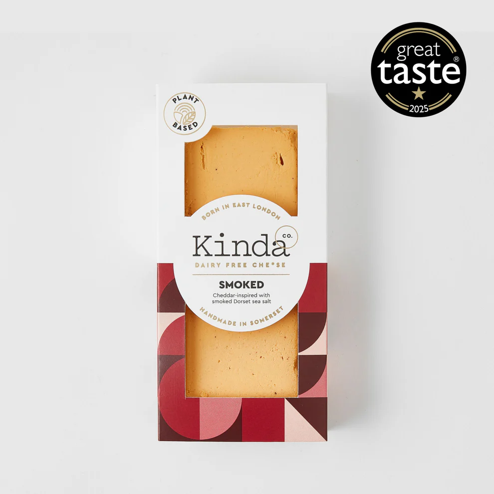 Packaged smoked dairy-free cheese with 'Kinda' branding and Great Taste award on a white background