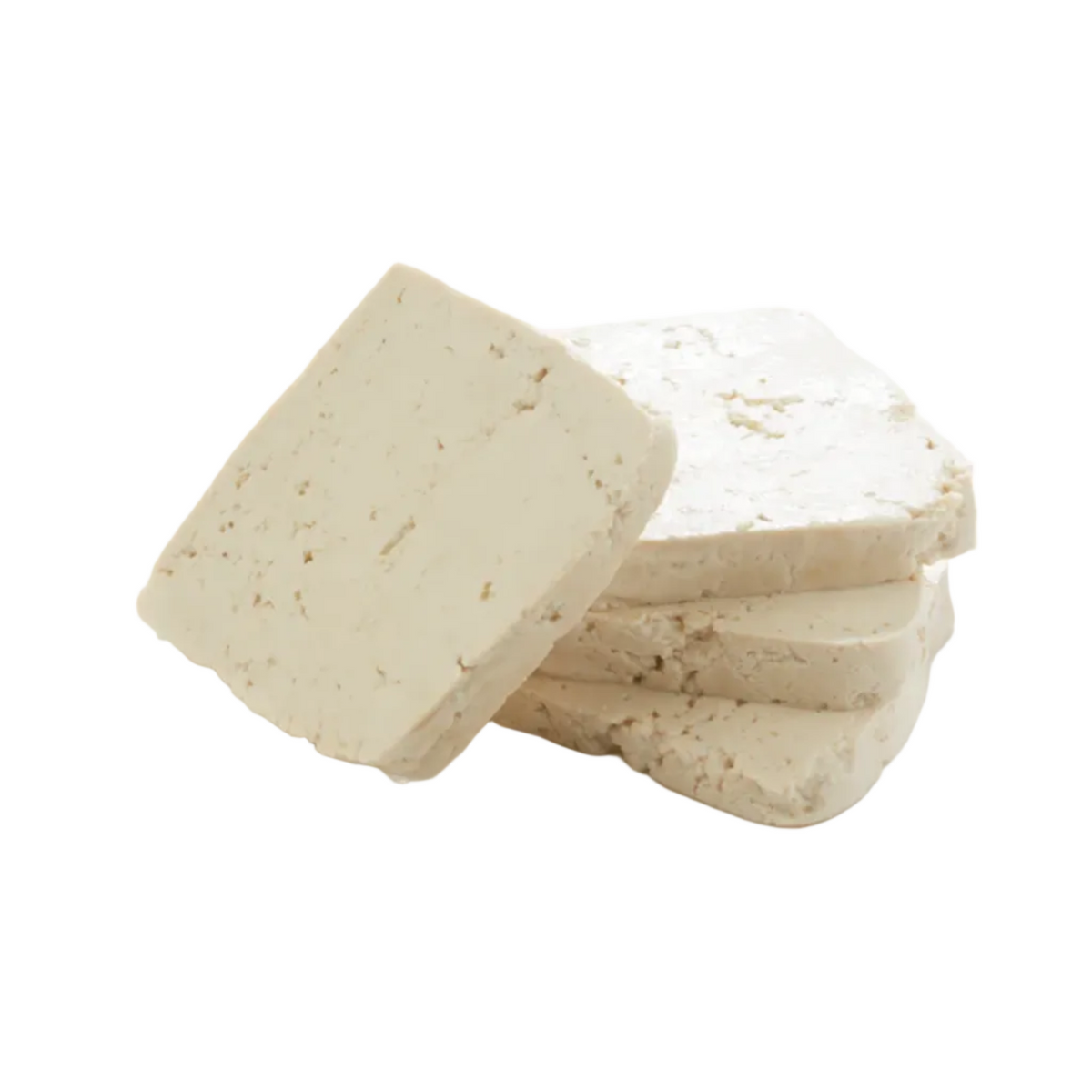 Four thick rectangular slices of off-white tofu stacked and leaning against each other on a clean white background.