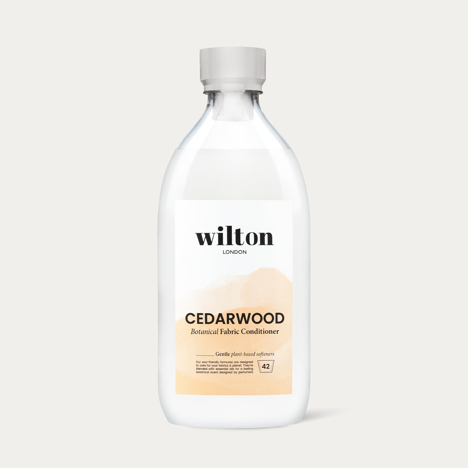 Bottle of Wilton Cedarwood Botanical Fabric Conditioner on a light gray background