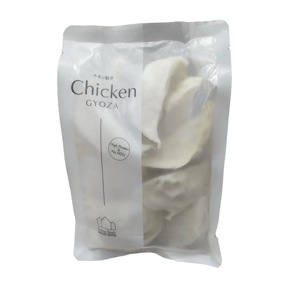 Packaged chicken gyoza in a clear plastic bag with visible text on a white background