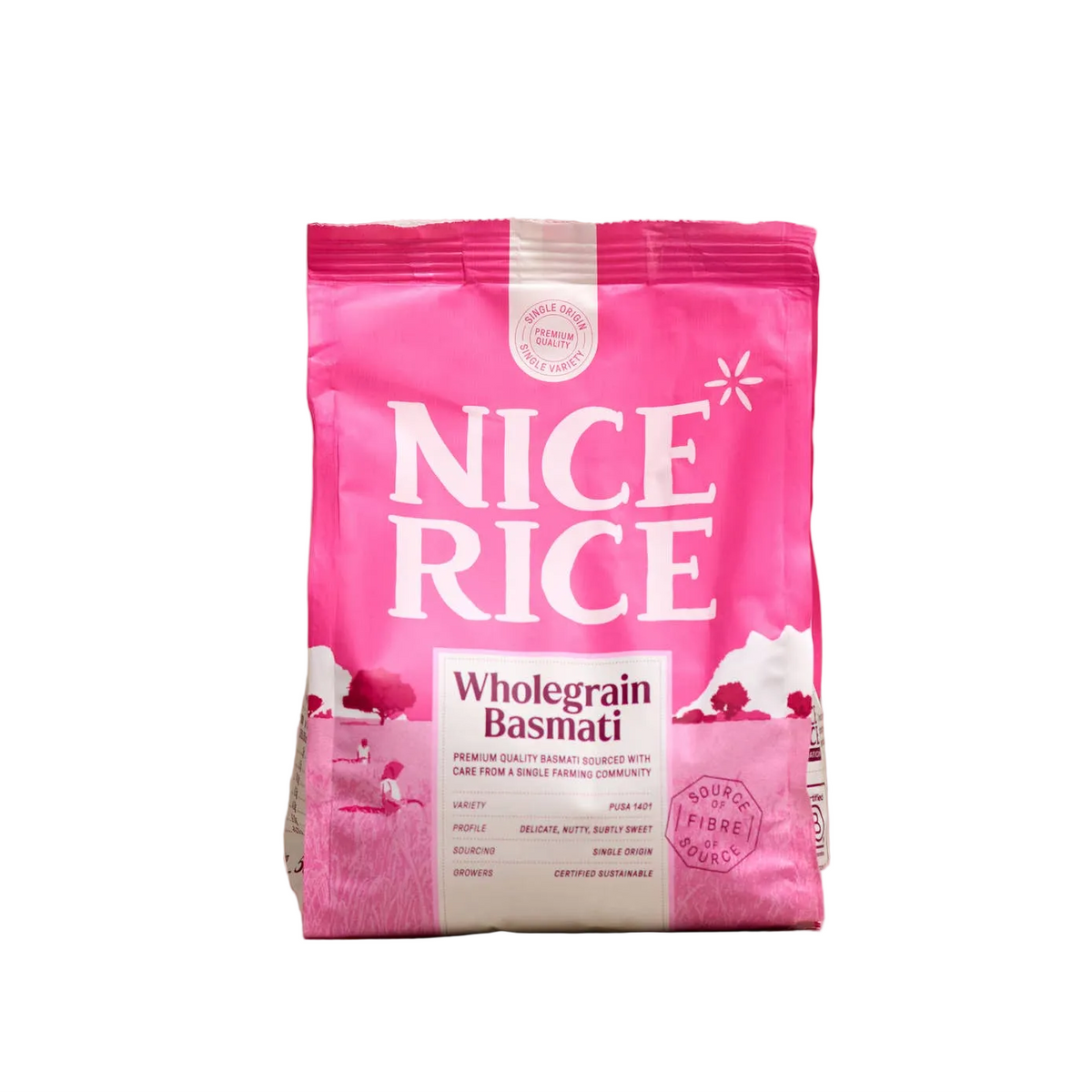 A pink bag of NICE RICE Wholegrain Basmati rice standing upright on a light beige marble surface against a matching beige background.