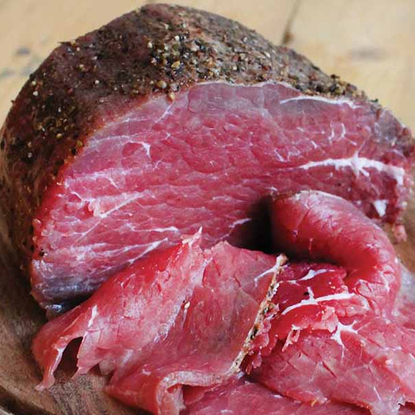 A close-up of manzo di pozzaa on a wooden chopping board 